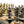 Load image into Gallery viewer, Roman Heads Set + Leatherette Chessboard Gold Black