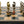 Load image into Gallery viewer, Roman Heads Set + Leatherette Chessboard Gold Black
