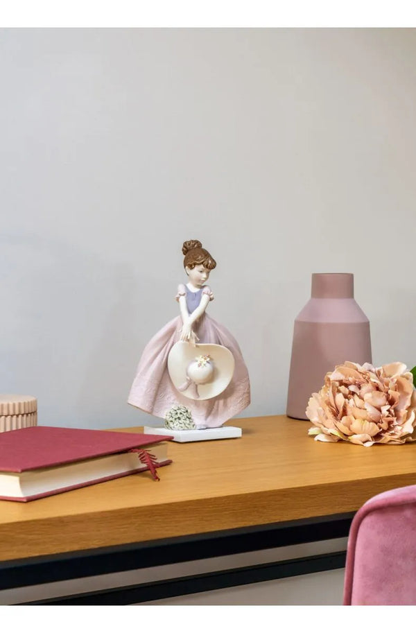 Straw hat in the Wind Girl Figurine