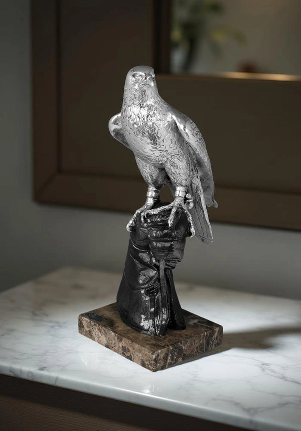 Falcon in silver hand